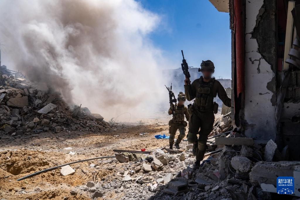 這張5月19日發(fā)布的照片顯示，以軍部隊(duì)在加沙地帶展開軍事行動。新華社發(fā)（以色列國防軍供圖）